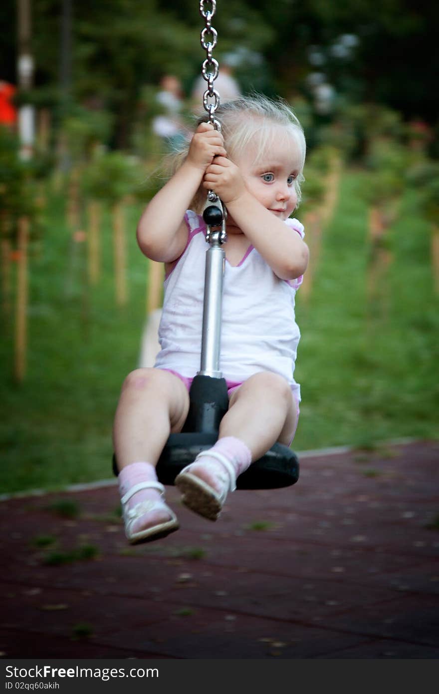 Courageos little girl playing in the park. Courageos little girl playing in the park