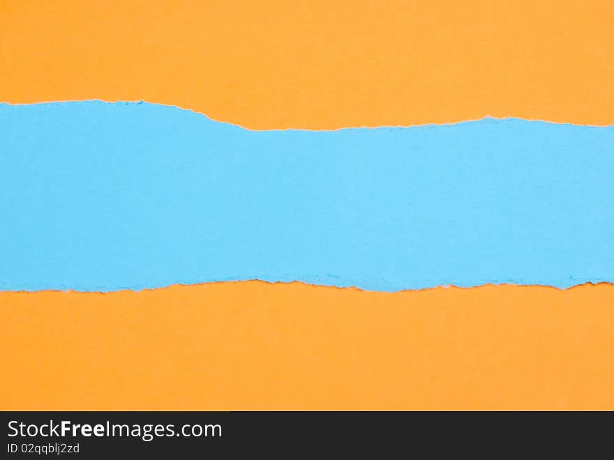 Ripped blue Paper on yellow background. Ripped blue Paper on yellow background