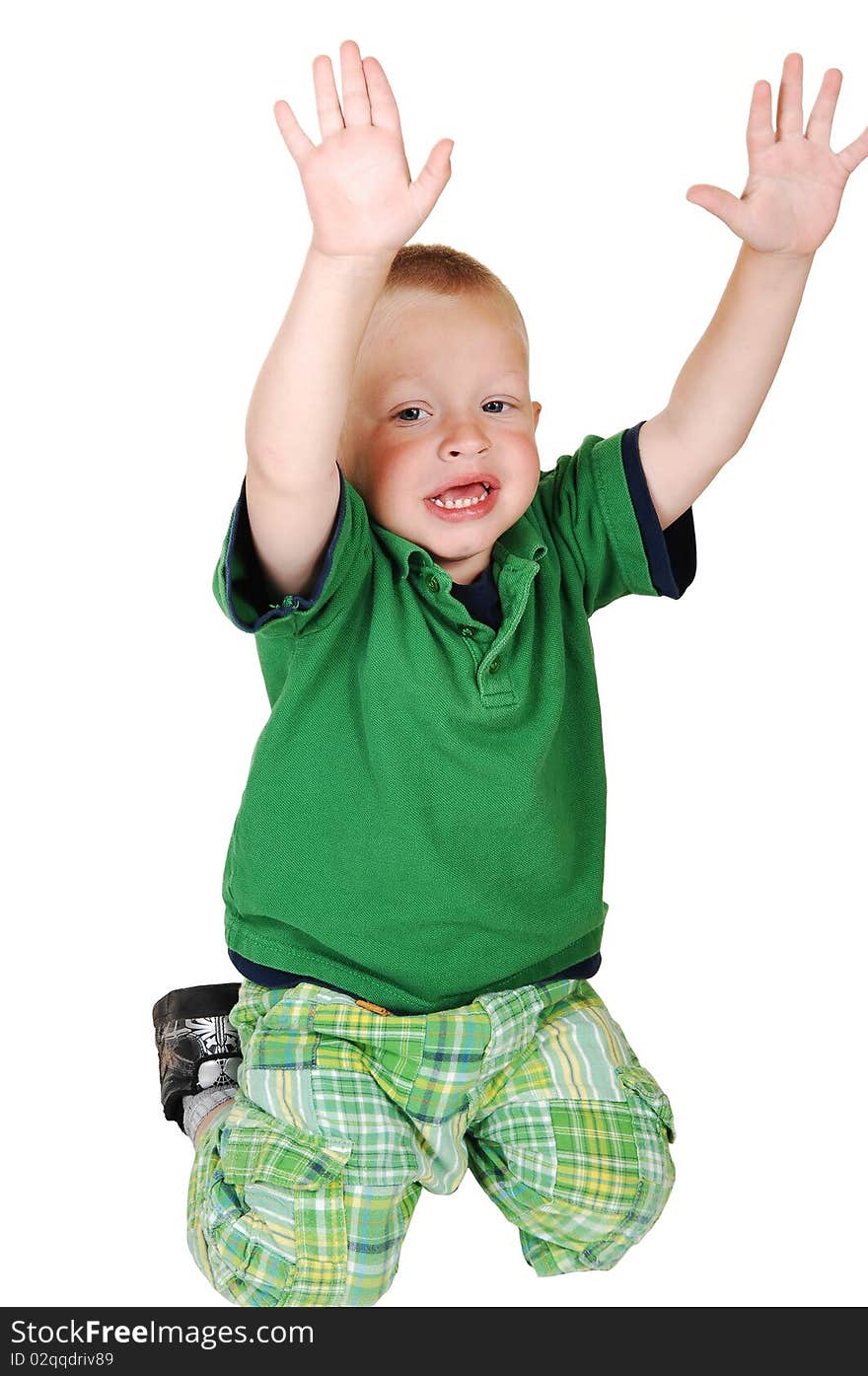 A lovely toddler kneeling on the floor in the studio holding up his
hands, on white background. A lovely toddler kneeling on the floor in the studio holding up his
hands, on white background.