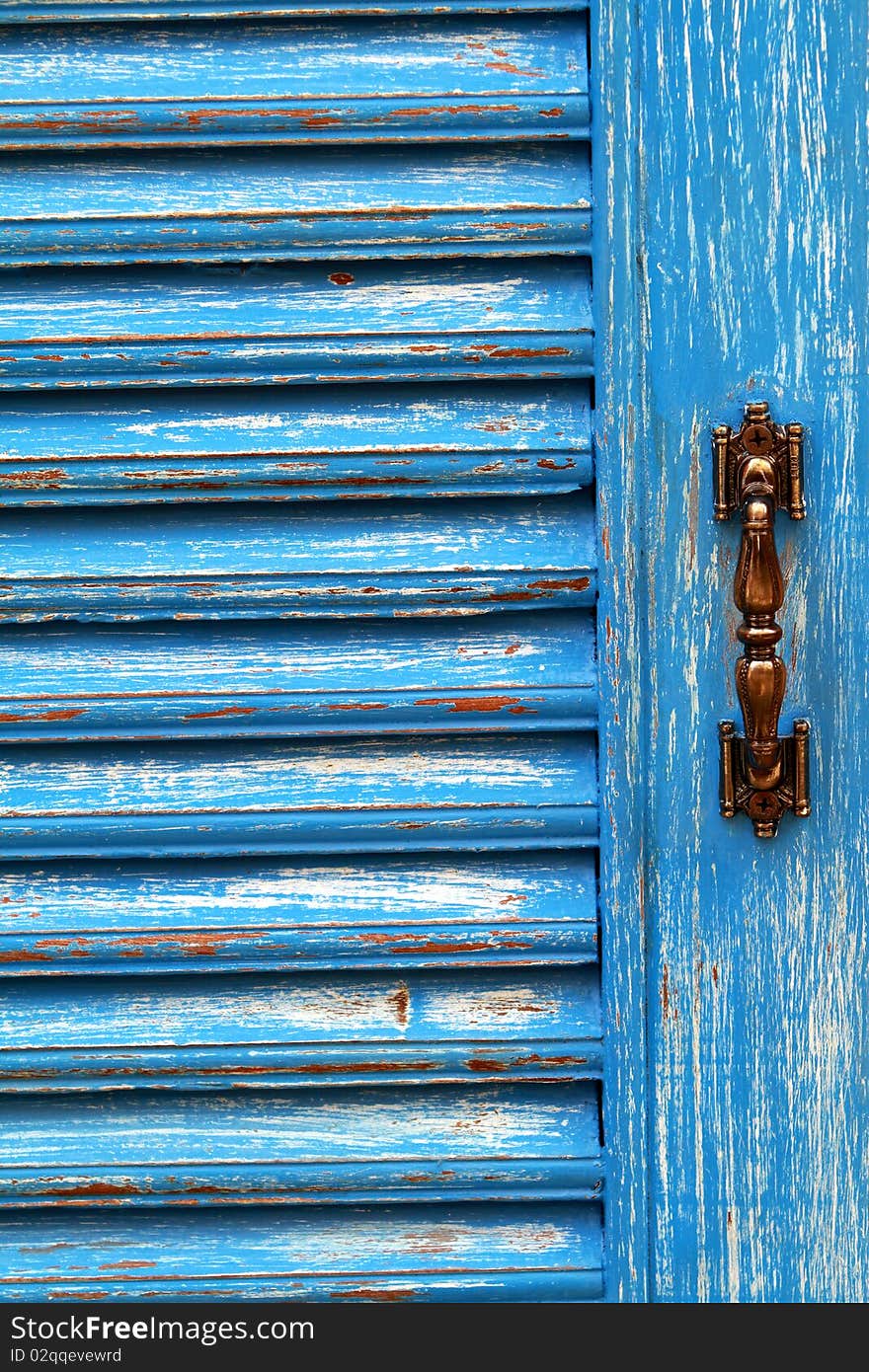 Blue wooden door and door handles