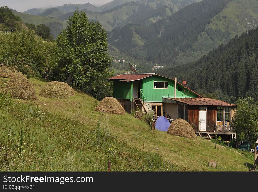 A rural house on a steep mountainside in Kazakhstan. A rural house on a steep mountainside in Kazakhstan.