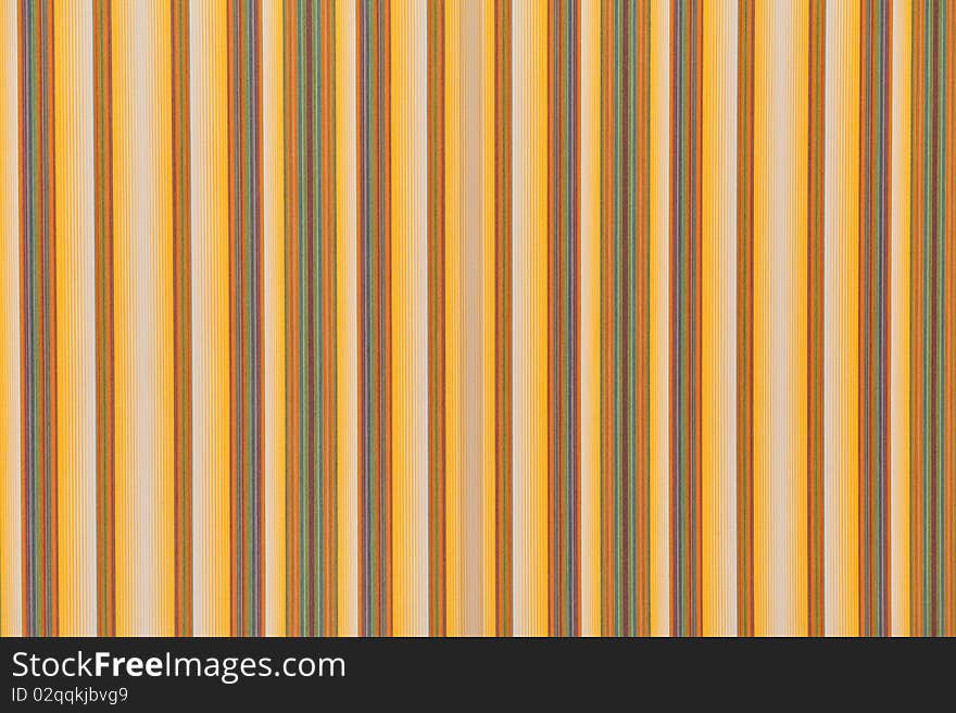 The image shows a background or a texture composed of a fabric of various colors arranged in bands. The image shows a background or a texture composed of a fabric of various colors arranged in bands.