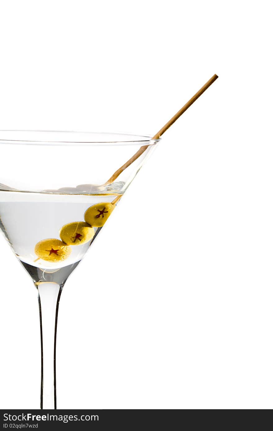 Martini with three olives isolated on white background