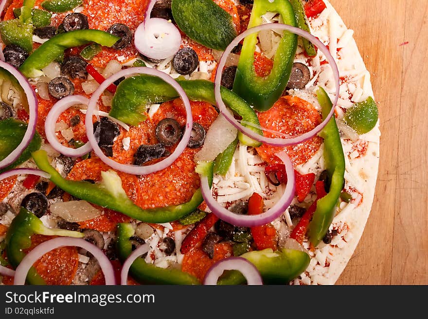 Raw Pizza With Vegetables And Pepperoni