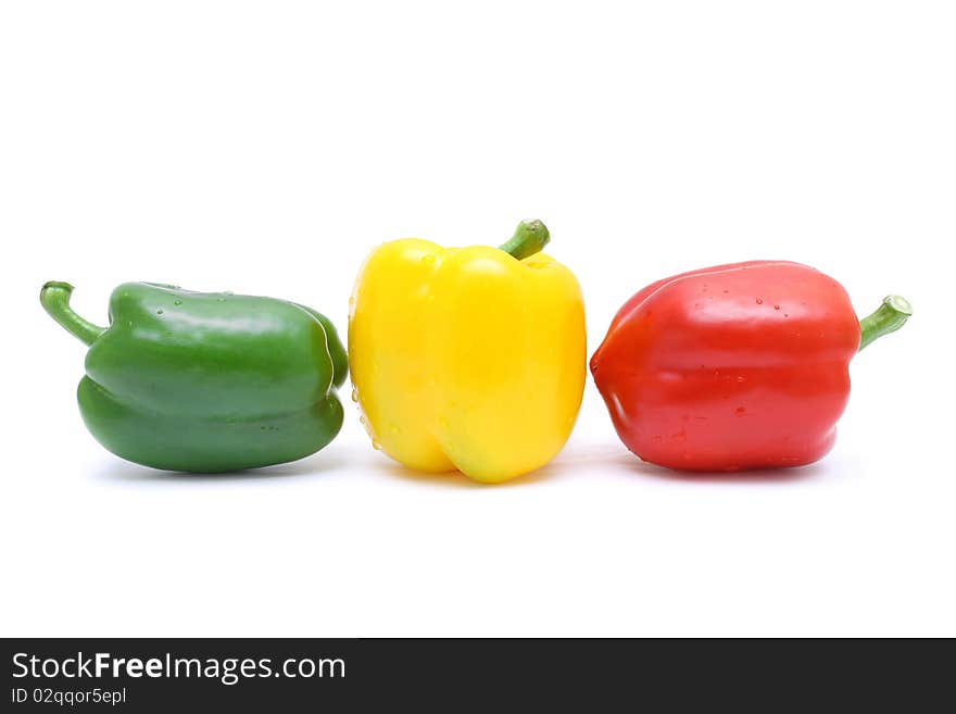 Close up of red, yellow and green pepper isolated on white background. Close up of red, yellow and green pepper isolated on white background.