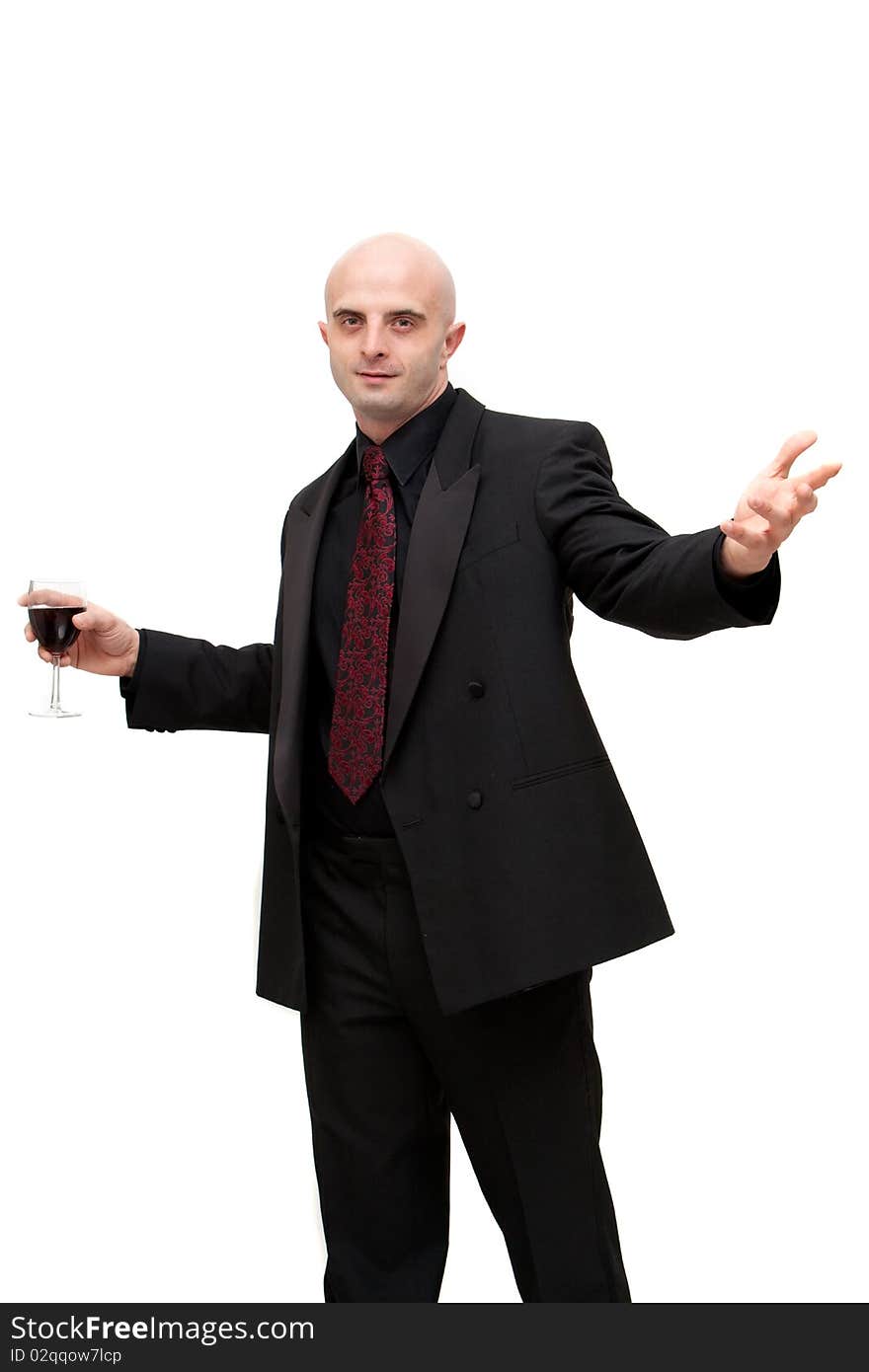 Young business man in dark suit holding a glass of wine. Young business man in dark suit holding a glass of wine