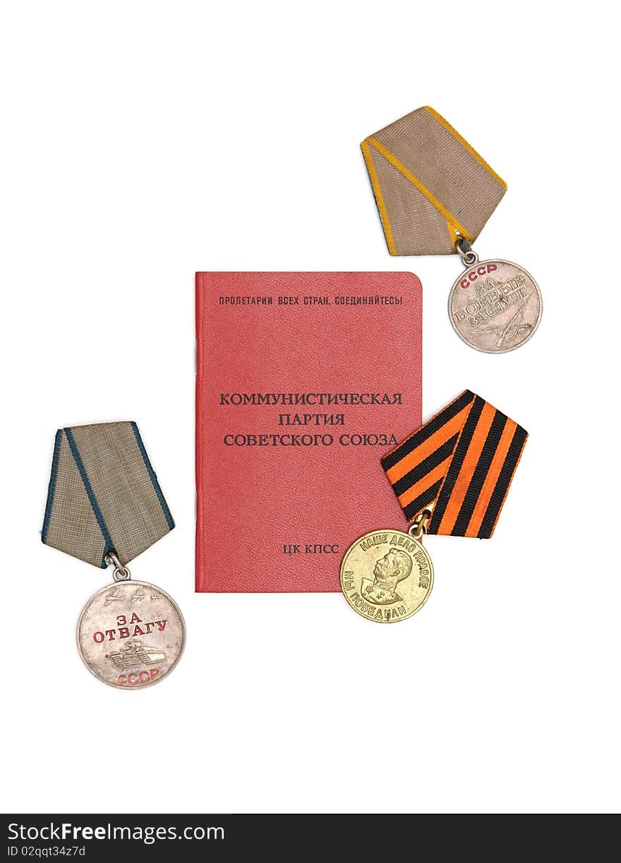 Soviet communist party membership card surrounded by old medals isolated. Soviet communist party membership card surrounded by old medals isolated