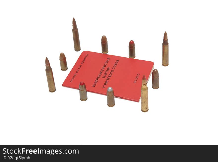 Soviet communist party membership card surrounded by cartridges isolated. Soviet communist party membership card surrounded by cartridges isolated