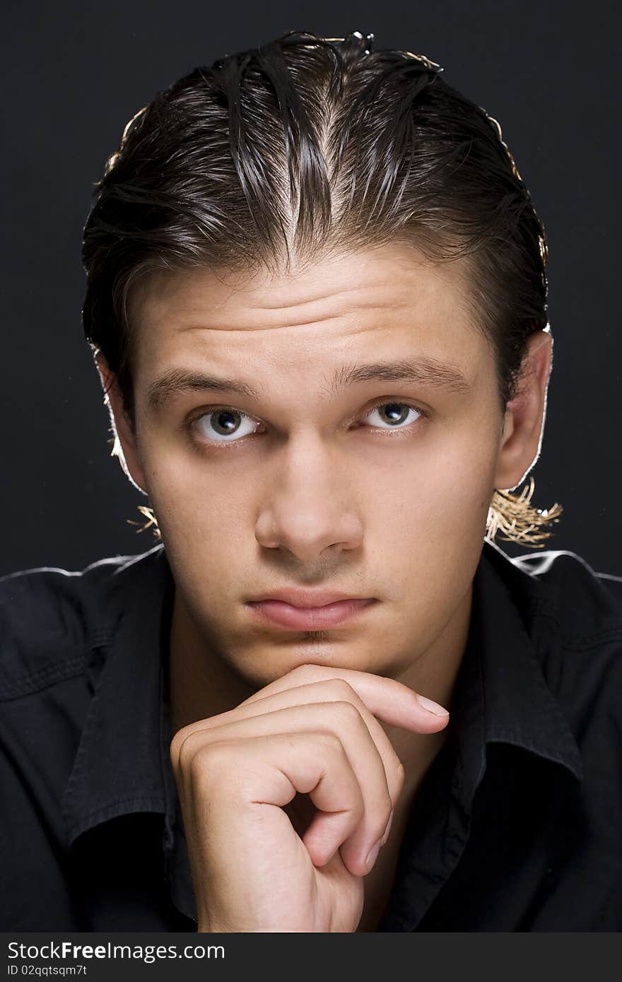 Portrait of young handsome man looking at camera. Portrait of young handsome man looking at camera