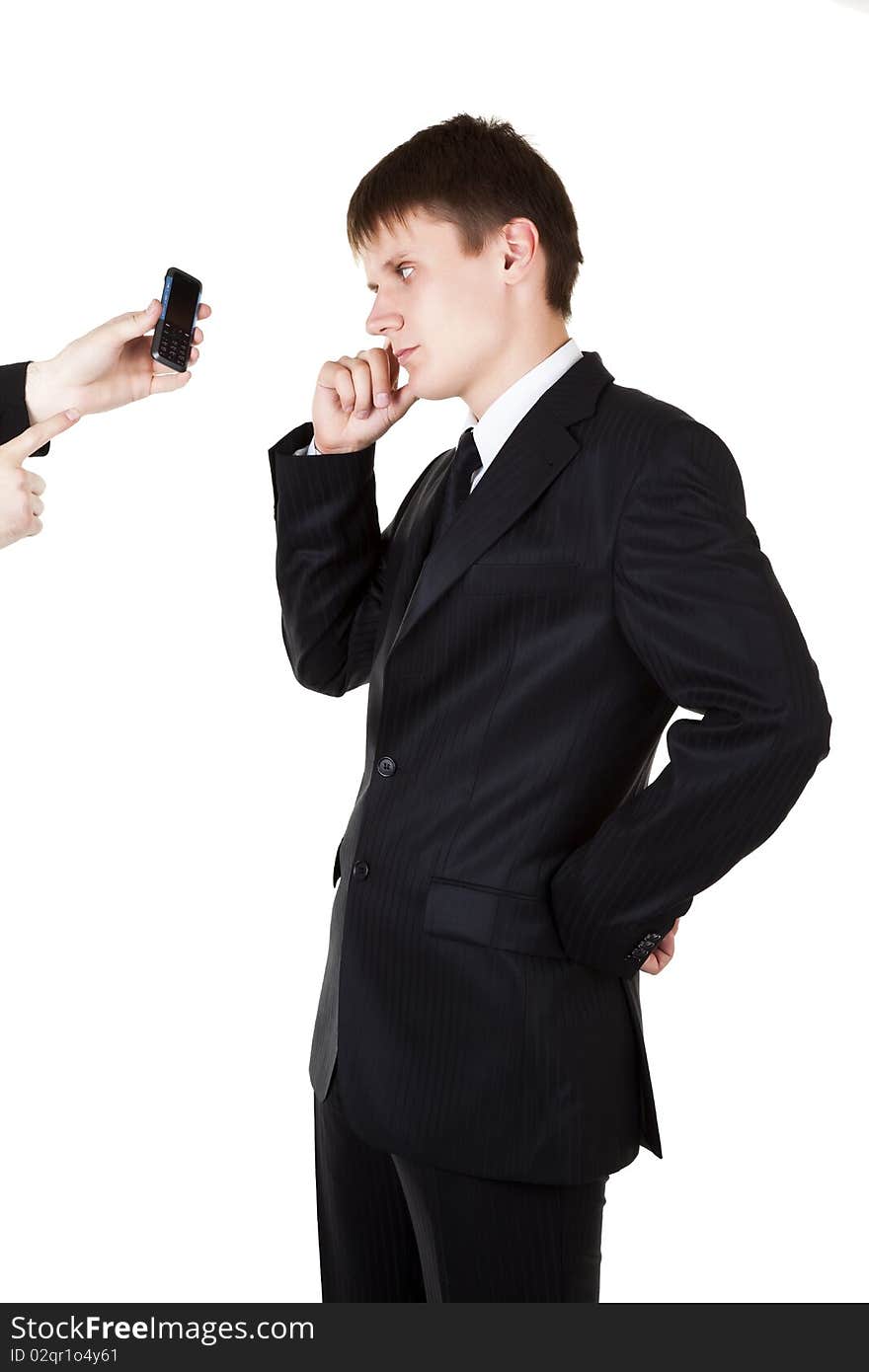 Young business man looking in mobile phone on white background