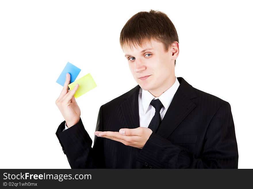 Young business man demonstrate credit cards on white background