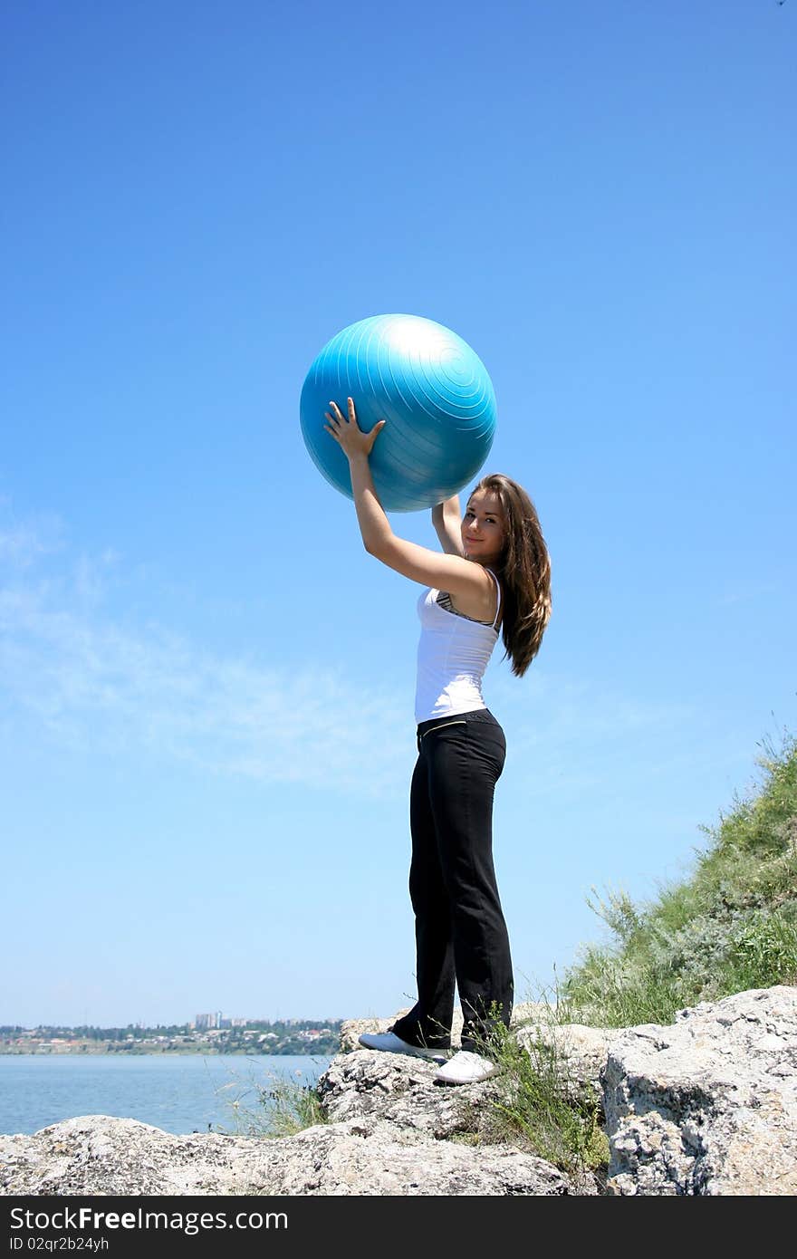 Young Woman Doing Yoga Exercises