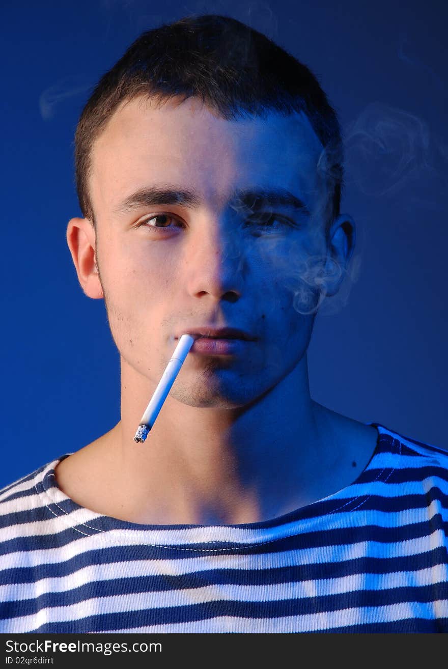 Young attractive man in striped jersey