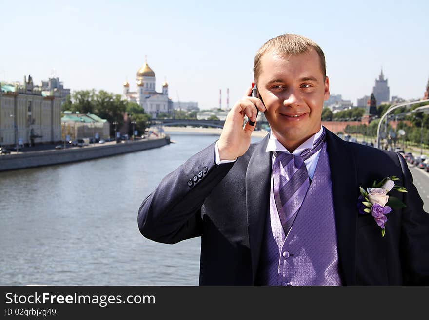 Portrait of the happy man in summer park