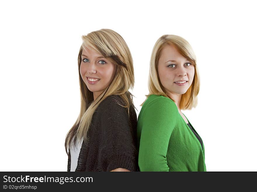 Two young caucasian girlfriends having fun together isolated over white background. Two young caucasian girlfriends having fun together isolated over white background