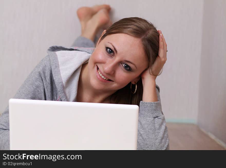 Closeup portrait of a young woman using a laptop