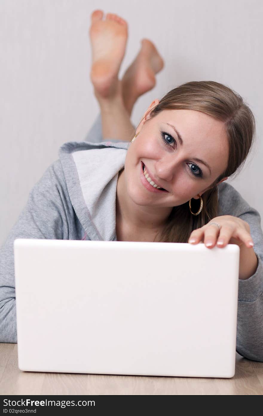 Closeup portrait of a young woman using a laptop