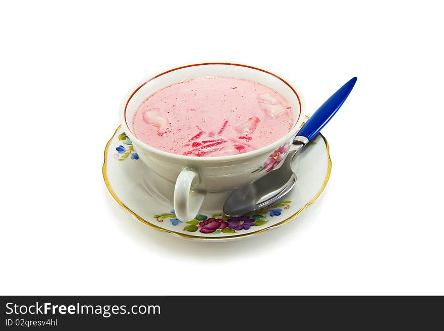 Beet soup in a bowl isolated on white