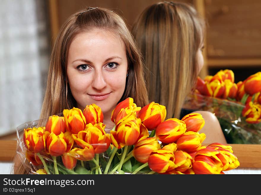 Blonde holding bunch of flowers