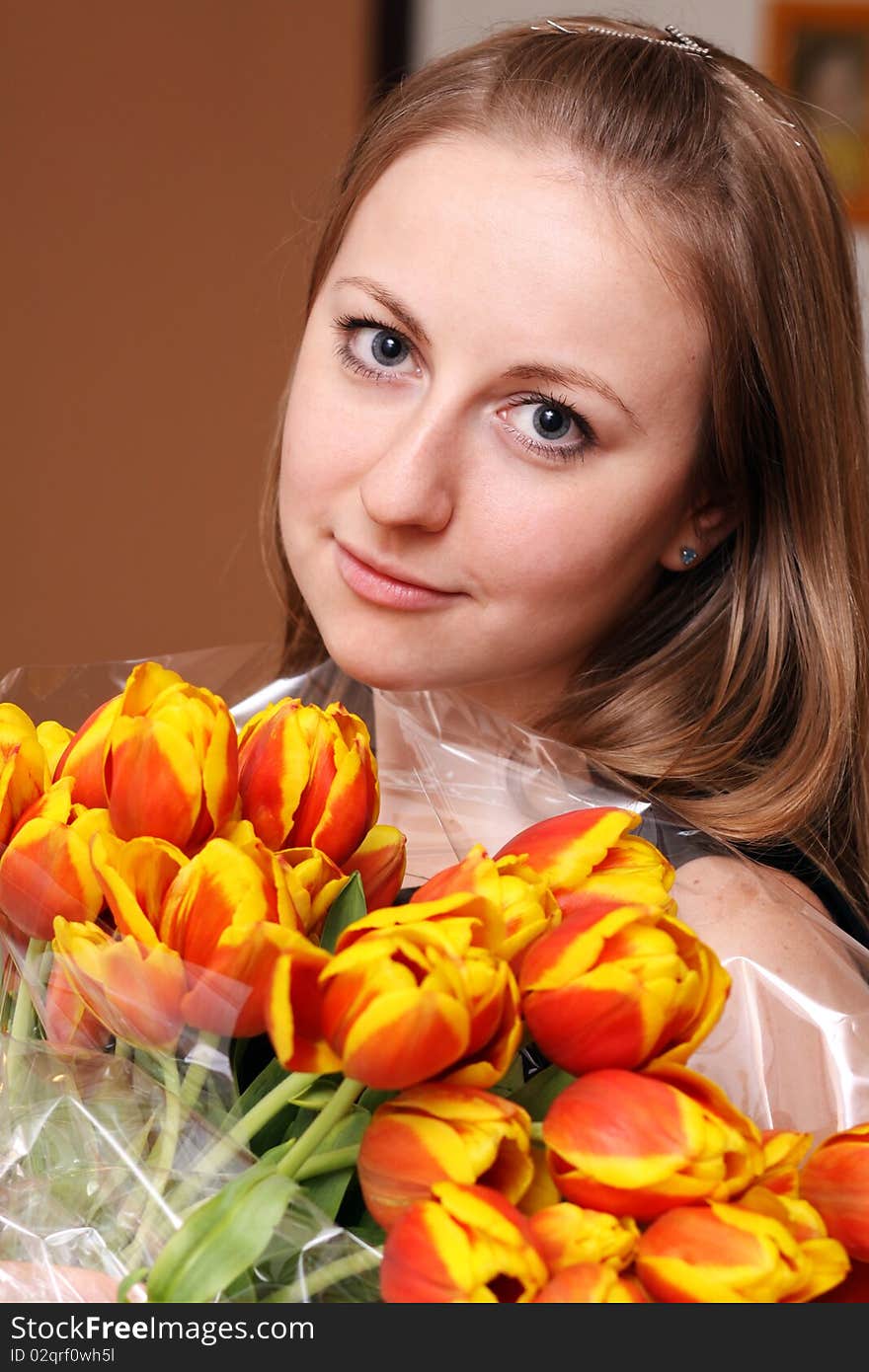 Blonde holding bunch of flowers