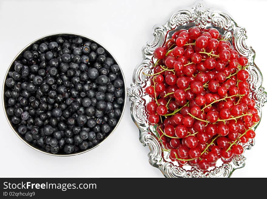 Fresh redcurrant and Blueberries on a silver platter