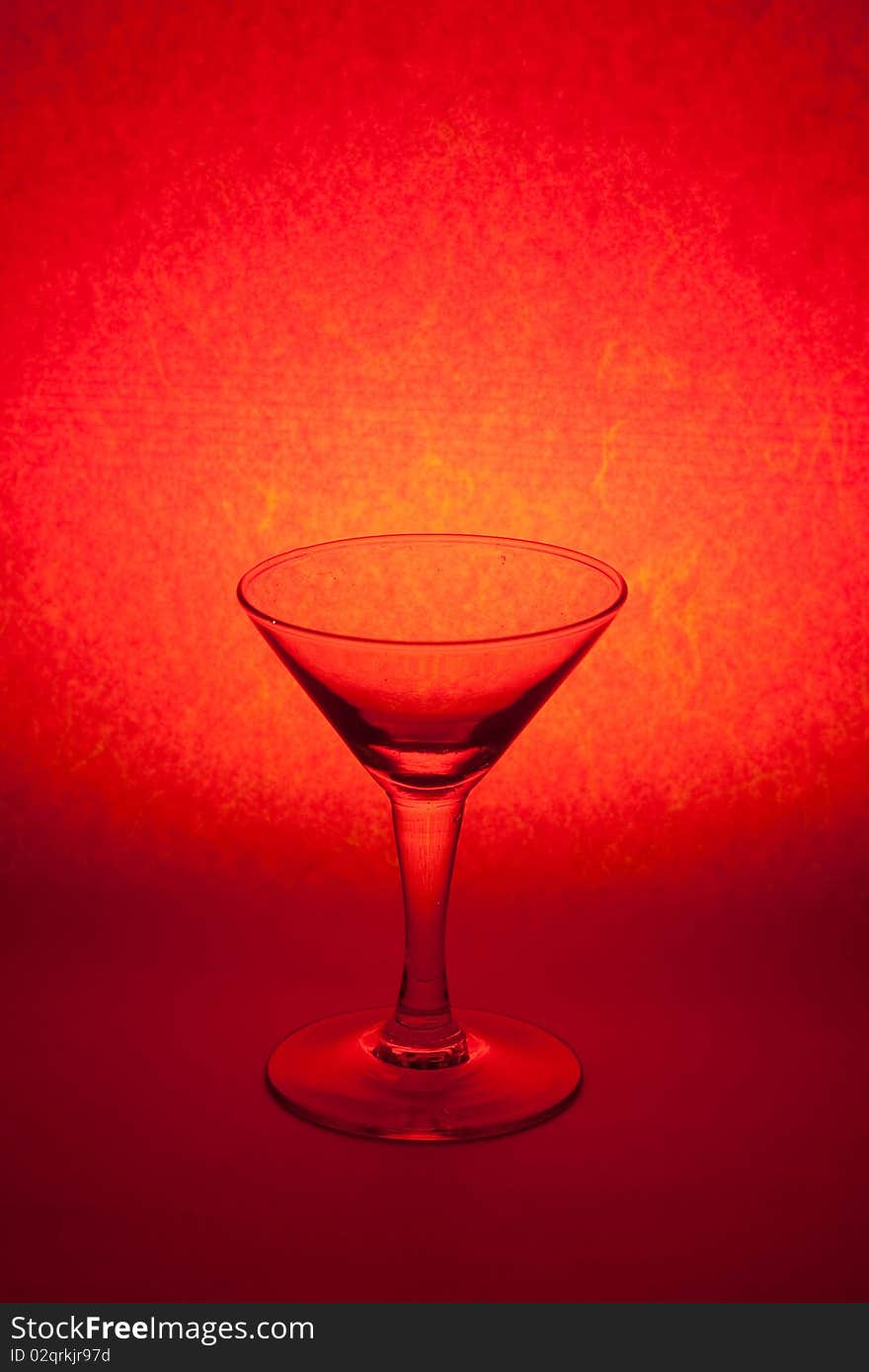 One glass on red background