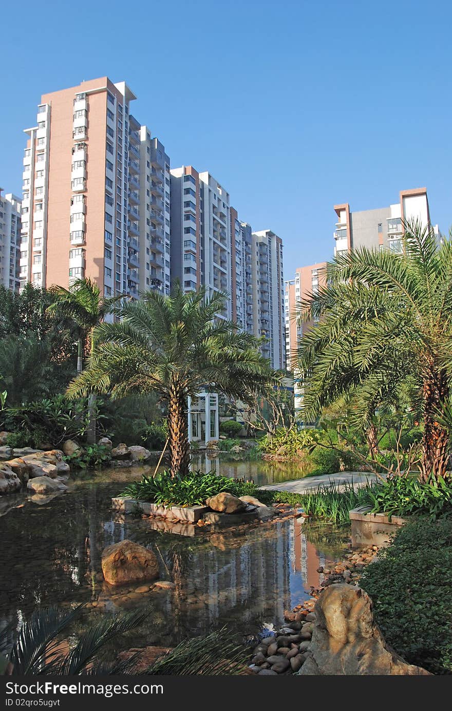 There are two upscale apartment block by the lakeside,beautiful reflection in the calm lake water suface.