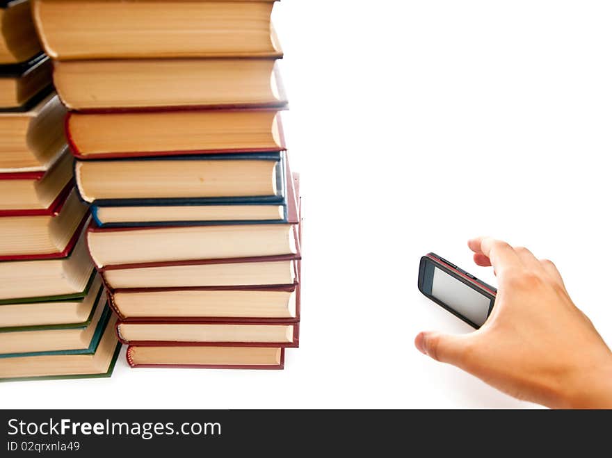 Row of books and mobile phone on white background. Row of books and mobile phone on white background