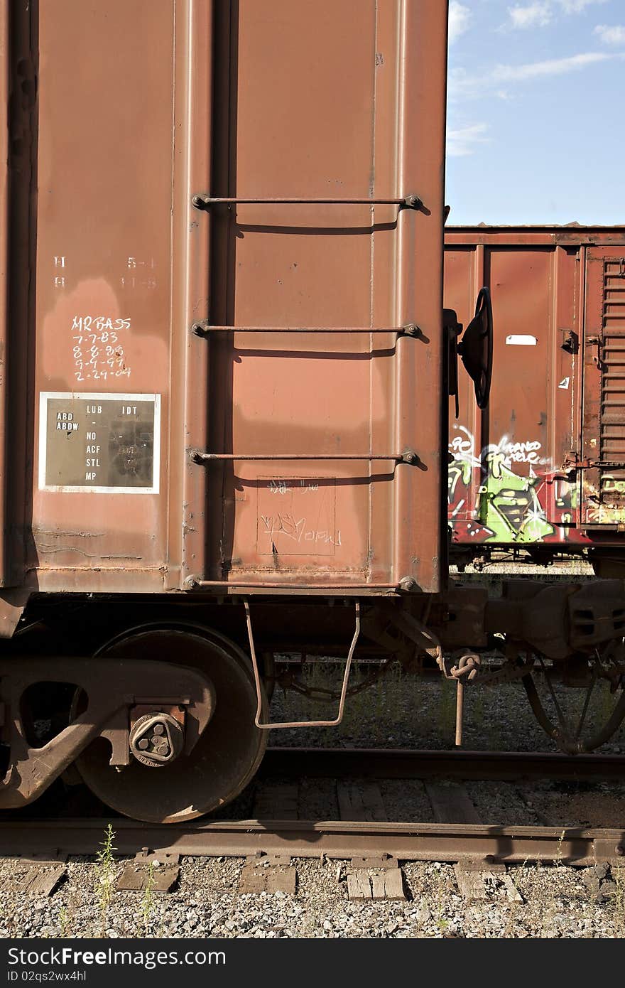 Train Boxcars with Graffiti Against a Blue Sky. Train Boxcars with Graffiti Against a Blue Sky