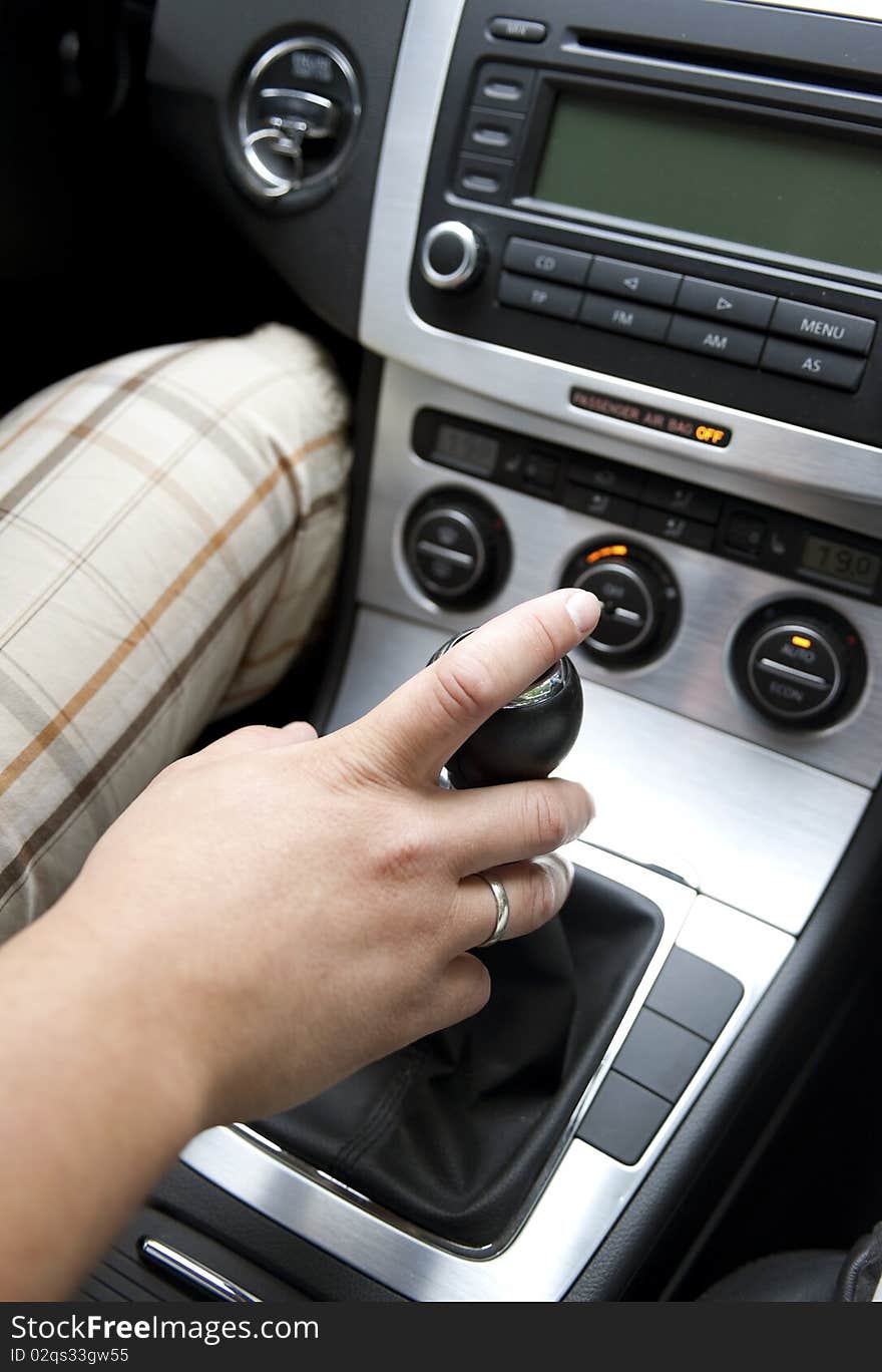 Close up of  hand on manual gear shift knob. Close up of  hand on manual gear shift knob