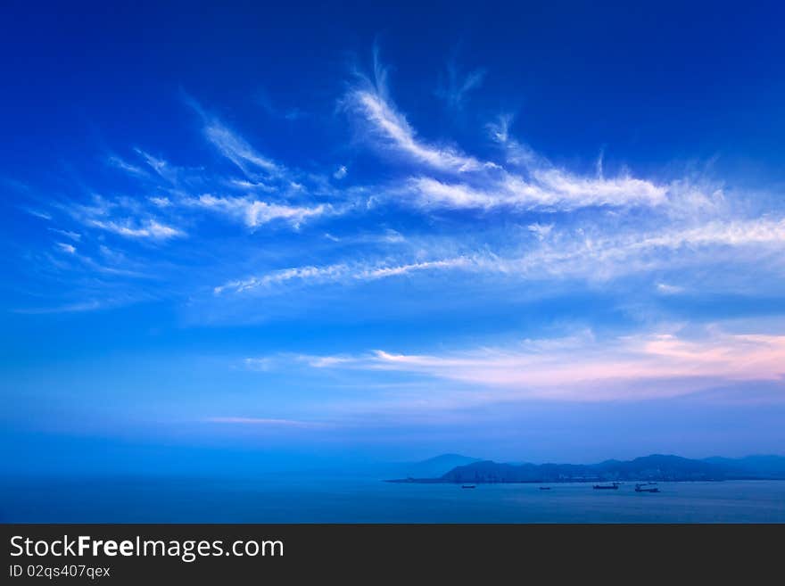 Blue sky and sea with slight cloud