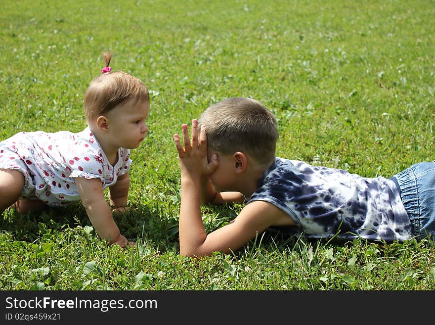 Children play on a grass