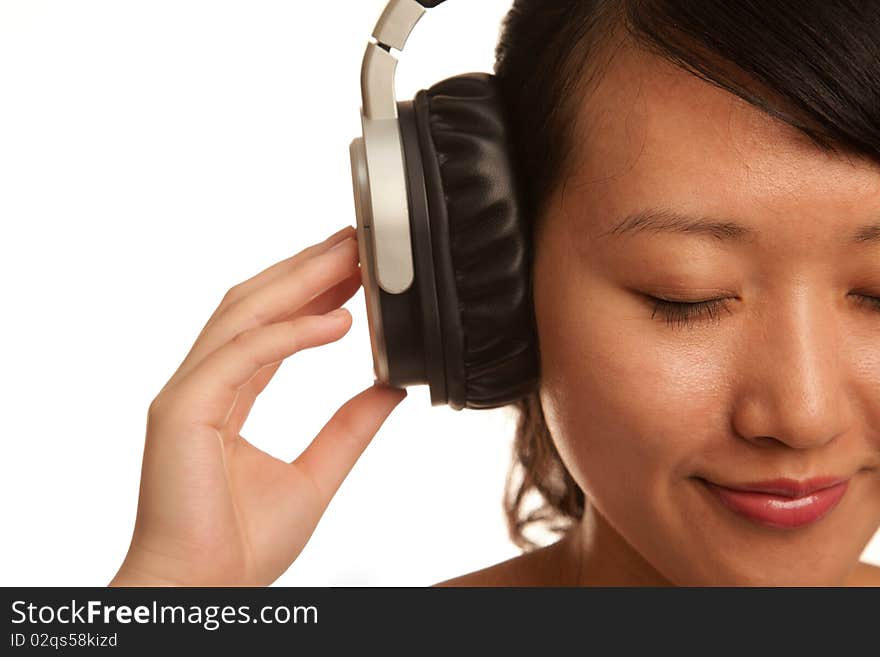 Woman listening to Music isolated on white