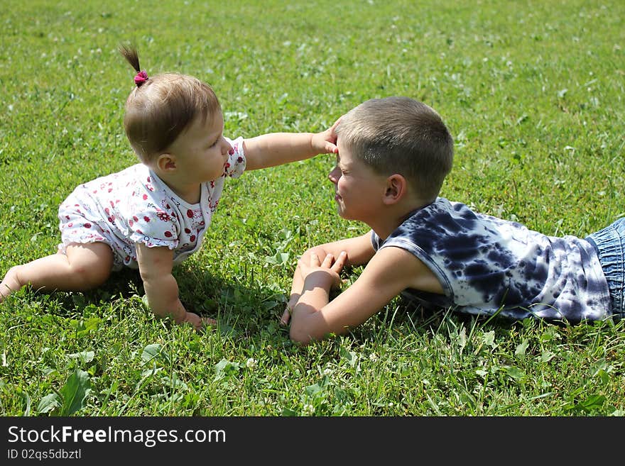 Children play on a grass