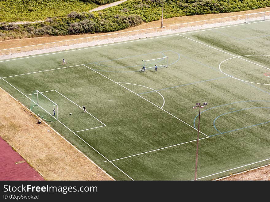 Kids playing soccer on field on Helgoland Island, Germany. Kids playing soccer on field on Helgoland Island, Germany.