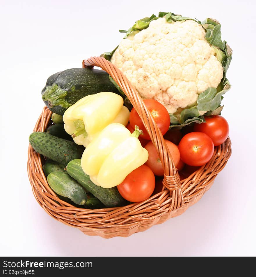 Basket full of vegetables on white background. Basket full of vegetables on white background