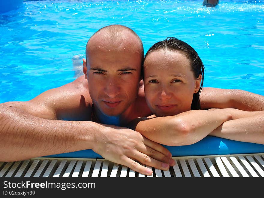 Happy couple in the pool