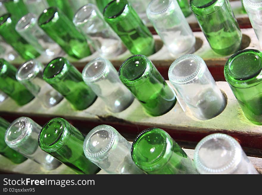 Group of green and white recycled glass wine bottles