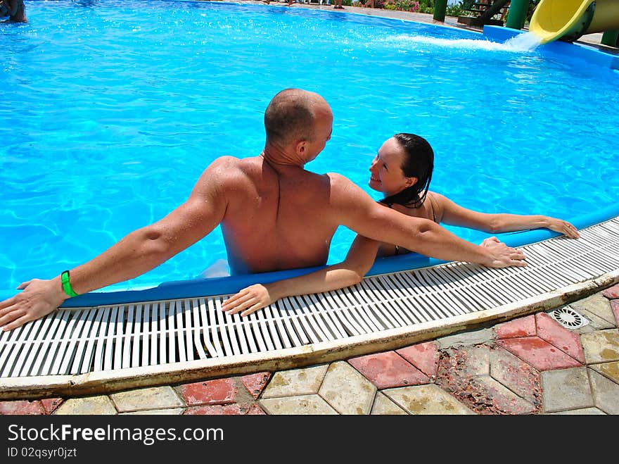 Happy couple in the pool