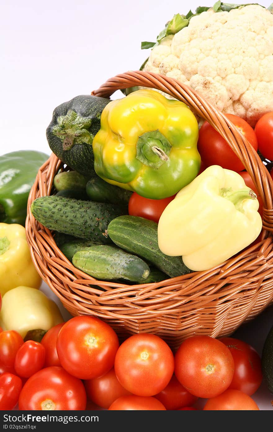 Basket full of vegetables on white background. Basket full of vegetables on white background