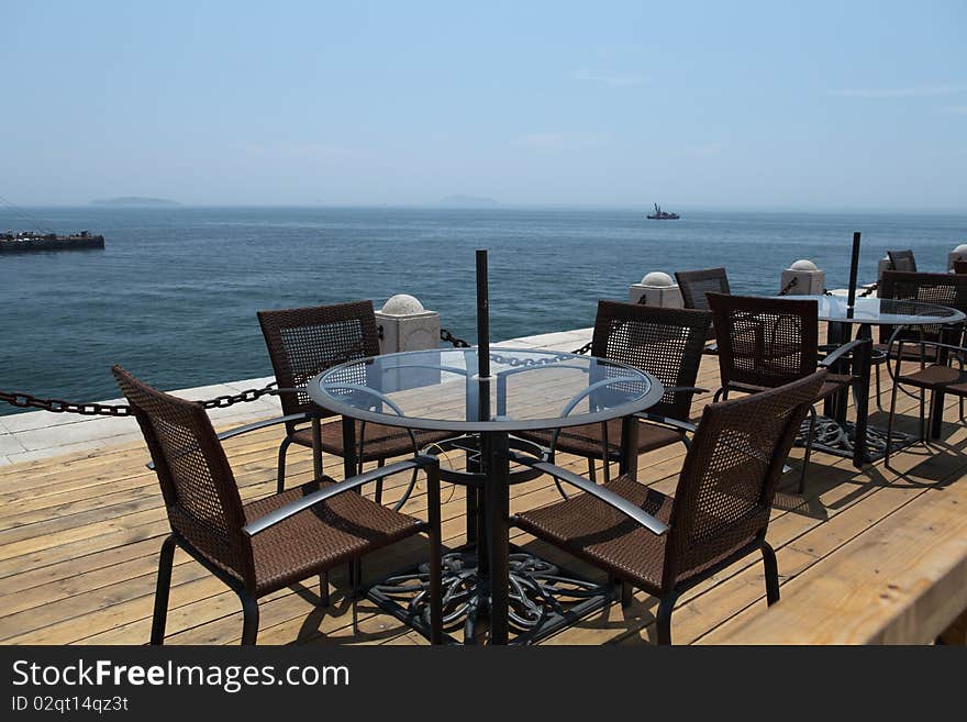 Leisure chairs and table at beach