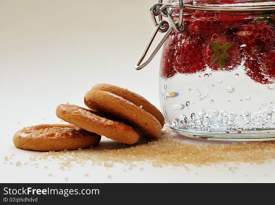 Biscuits with raspberries on a white background