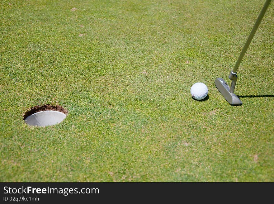 Golf Hole With Ball And Flag