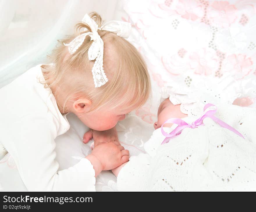 The image of the girl and its newborn sister. The image of the girl and its newborn sister