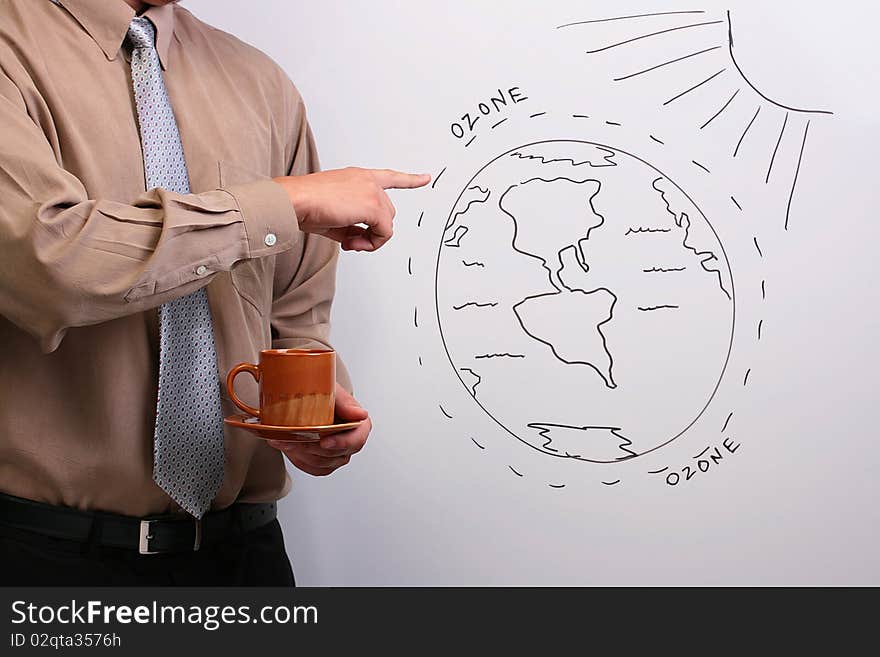 Man in a shirt and a tie pointing to a diagram of the earth's ozone layer. Man in a shirt and a tie pointing to a diagram of the earth's ozone layer.