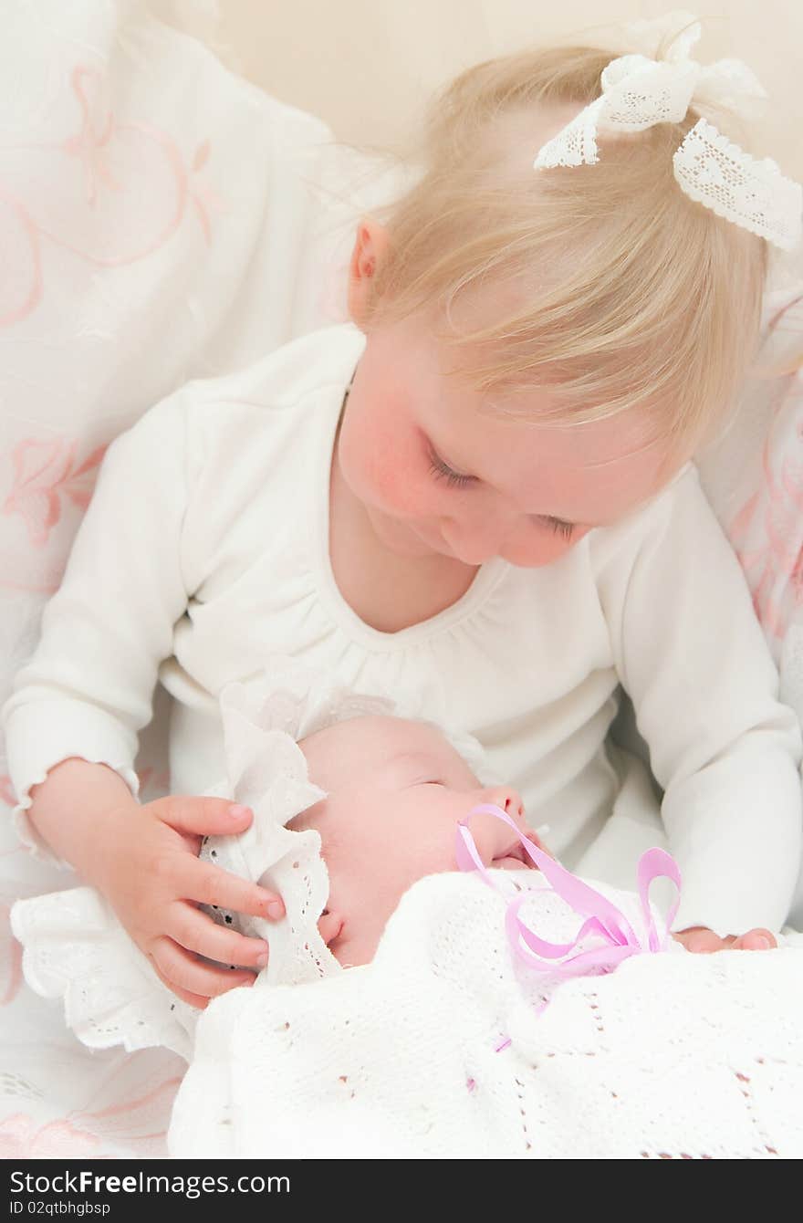 The image of the girl and its newborn sister. The image of the girl and its newborn sister