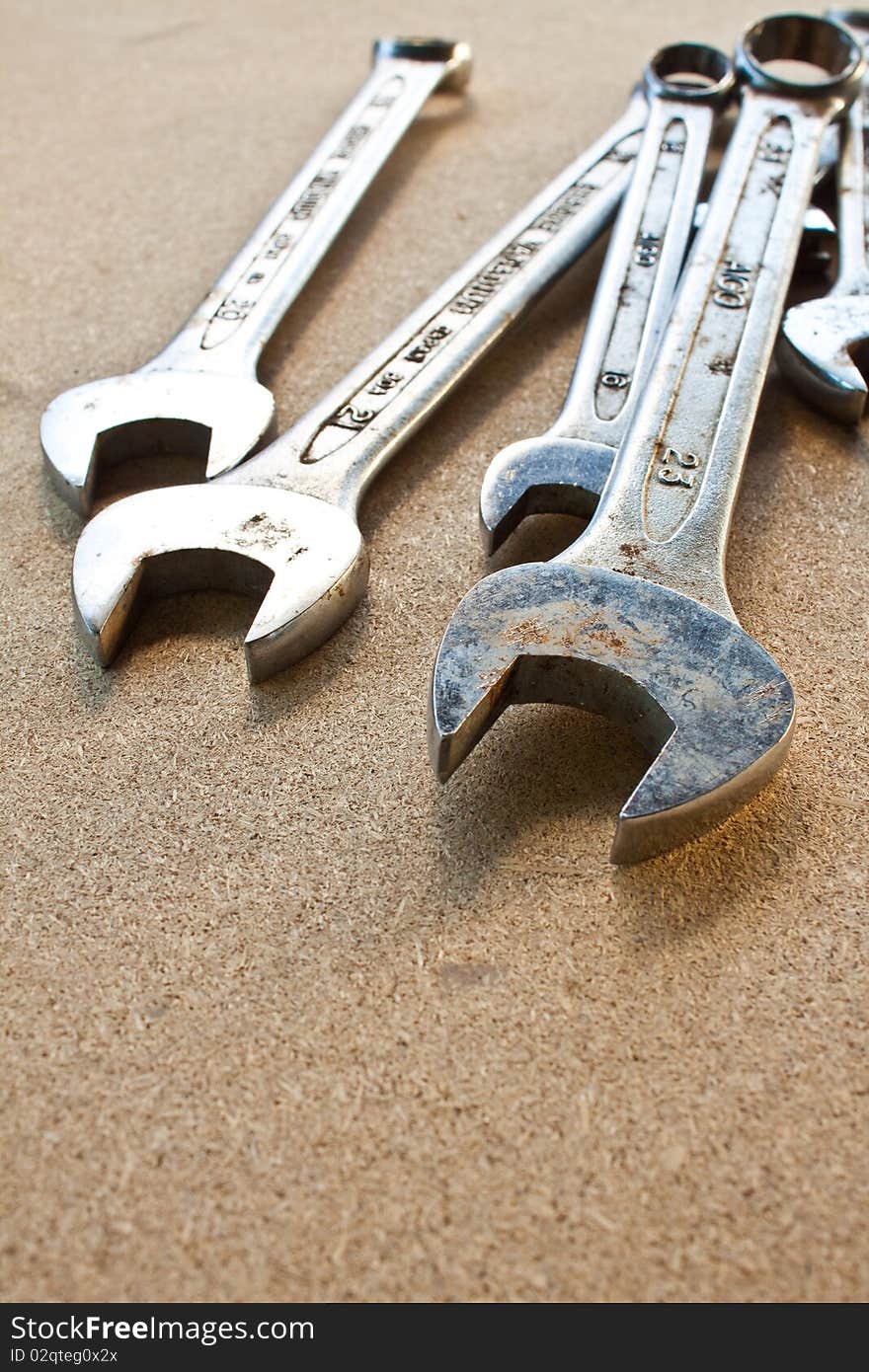 Close up view of spanner on wood board