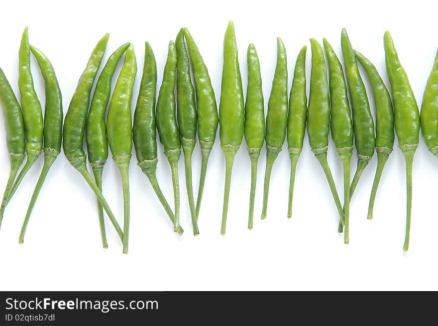 Green chili on white background