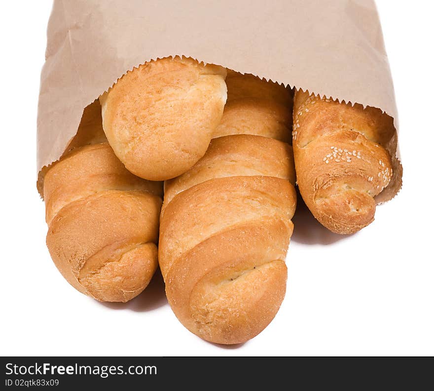 Isolated bread in paper packet on white