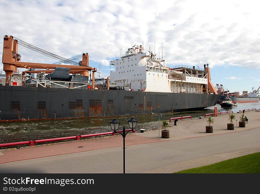 Container ship coming into port Ventspils, Latvia